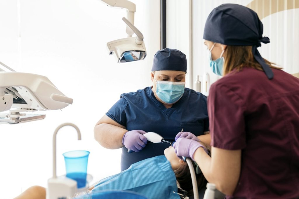 Dental Clinic Workers With Young Patient